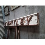 G WHITLEY shop name sign.