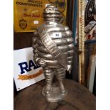 Unusual polished steal Michelin Man advertising figure.
