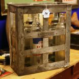 Esso Oil crate with four bottles and an oil can .