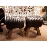 Pair of black leather stools with four out swept feet. (38 cm h x 40 cm w).