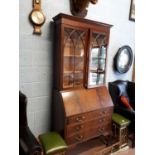 Late Edwardian mahogany fall front glazed bookcase. (207 cm h x 89 cm w x 47 cm d).