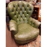 Pair of green leather armchairs