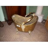 Victorian brass coal bucket on brass feet with wooden handle. ( 26 cm h).