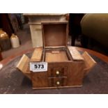 1930's walnut cigarette dispenser in the form of a chest of drawers.