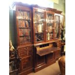 Regency style inlaid breakfront glazed bookcase with a secretaire drawer flanked by two short