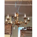 Early 20th C. brass chandelier in the Rocco style.