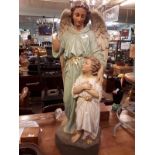C19th. Statue of angel with child.
