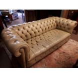 Green leather three seater chesterfield sofa. (206 cm l x 90 cm d).