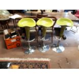 Three 1980's chrome and plastic breakfast chairs.