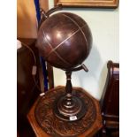 Modern tooled leather globe on stand. (67 cm h).