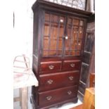 Early 19th. C. pine cupboard with two glazed doors over two short drawers over two deep long drawers