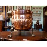 Edwardian copper and brass coal bucket raised on lion's paw feet. (35 cm h x 35 cm w).