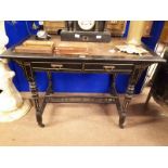 Victorian Ebonised writing desk with tooled leather top with two drawers in frieze and four turned
