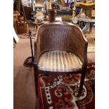 Bergere walnut chair with upholstered seat.