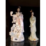 Two ceramic figures of Oriental Ladies. (28 cm h).