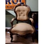 Upholstered Gent's armchair with cabriole legs.