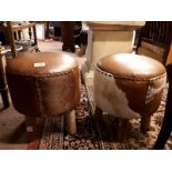 Pair of leather and hide circular stools with four legs. (46 cm h x 39 cm w)