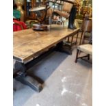 Early 19th. C. Oak refectory table on two shaped supports with single stretcher with sleigh feet. (