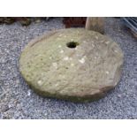 18th. C. sandstone millstone. { 150cm dia. }.