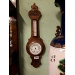 Victorian carved oak barometer. (65 cm h x 19 cm w).