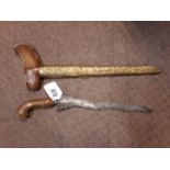 19th. C. Kris with wave blade and brass scabbard. .