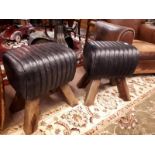 Pair of black leather stools with four out swept feet. (38 cm h x 40 cm w).