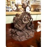 Exceptional quality 19th C. oak black forest clock profusely carved with birds.