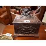 19th. C. carved oak Black Forest cigar cabinet surmounted with wolves and foliage . (29 cm h x 26 cm