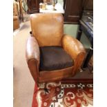 Pair of leather tub chairs.