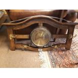 Edwardian oak and brass barometer in the form of a hanging hat stand.(44 cm h x 78 cm w).