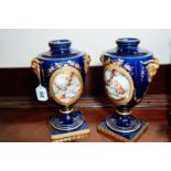 Pair of ceramic vases the cartouche with hand painted panels, in the Serves style. { 34cm H }.