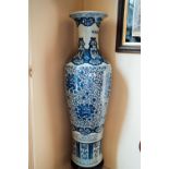 Pair of large Oriental ceramic blue and white vases. { 137cm H }.