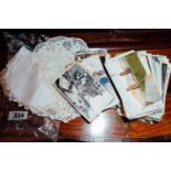 Pair of crocheted place mats and collection of 19th. C. and later postcards.