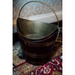 Georgian mahogany oyster bucket with brass mounts and brass liner. { 37cm H X 35cm W }.