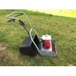 Honda petrol lawn mower with roller.