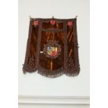 Early 19th. C. silk embroided banner decorated with two axes and a castle . { 109cm H X 88cm W }.