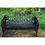 Cast iron garden bench with oak leaf design in the Coalbrookdale style. { 92cm H X 166cm W X 72cm
