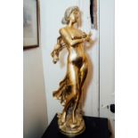 Pair of decorative brass figurines of ladies. { 80cm H }.