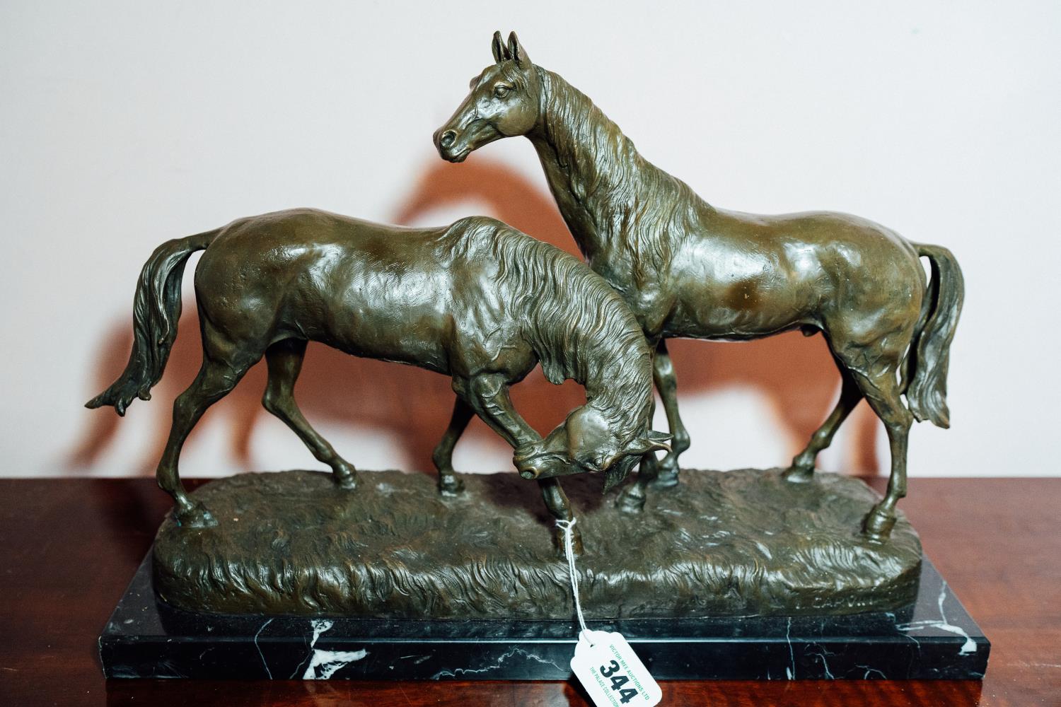 Bronze figural group of mare and stallion mounted on a marble base. { 36cm H X 52cm W X 18cm D }.