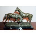 Bronze figural group of mare and stallion mounted on a marble base. { 36cm H X 52cm W X 18cm D }.