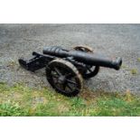 Pair of cast iron cannons. { 55cm H X 50 cm W X106 cm D }.