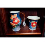 Royal Doulton jug and vase with floral decoration { Jug 23 cm H Vase 18 cm H }.