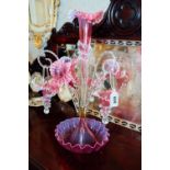 19th. C. ruby and clear galss epergne with centre flute and three hanging baskets with barley