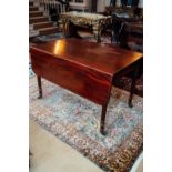 Georgian mahogany Pembroke table raised on reeded legs withn brass casters. { 72cm H X 113 cm W X