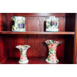 Two Wemyss Ware fruit preserve jars decorated with plums and two Wemyss Ware Lady Eva Vases with