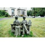 Cast bronze model of a Lady and Gentleman seated on a bench. { 102cm H X 129cm W X 85cm D }.