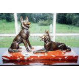 Bronze model of two German Shepherd dogs mounted on rouge marble base. { 30cm H X 53cm W X 18cm D }.