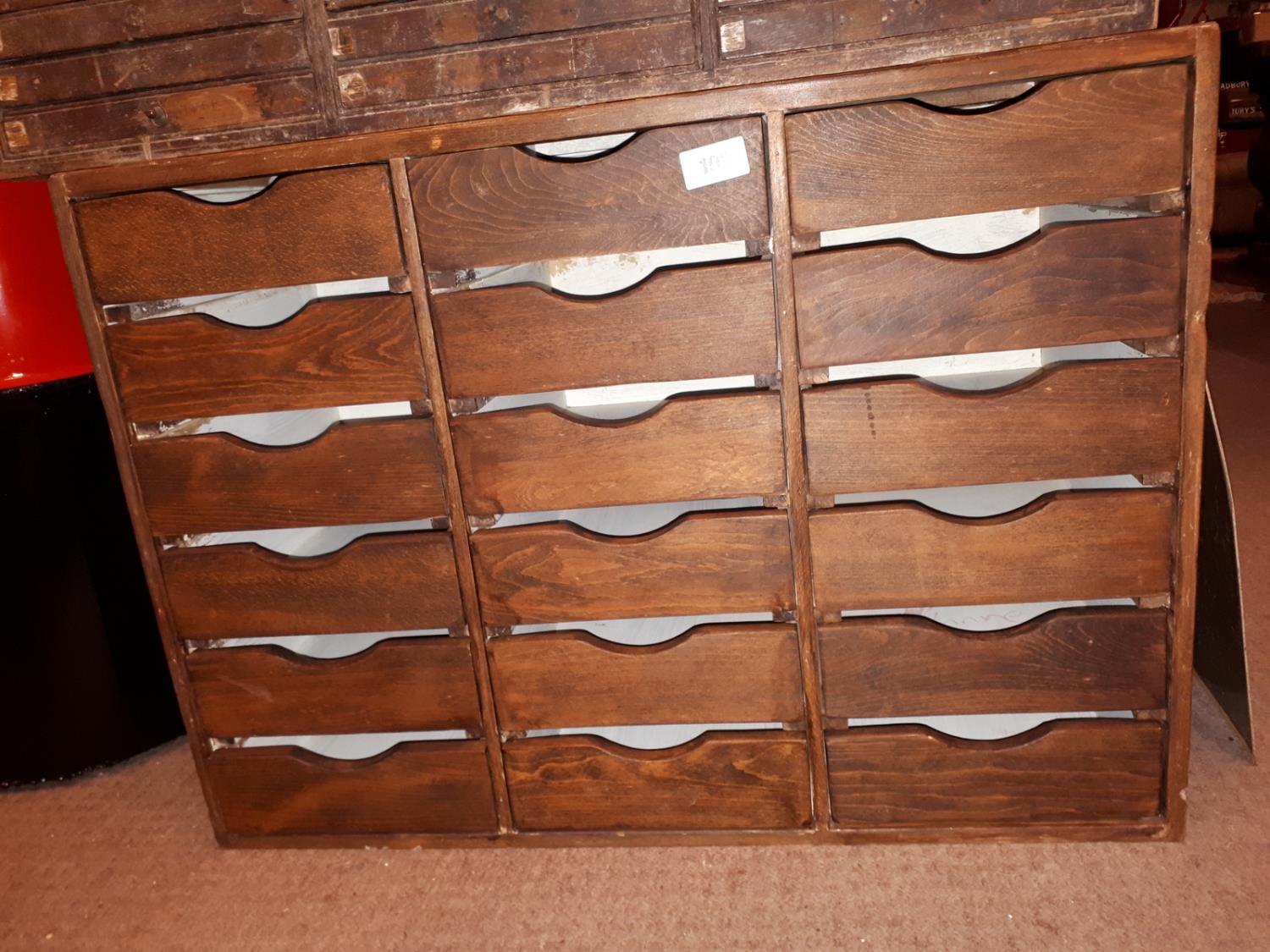 Vintage wooden bank of eighteen draws {61 cm H x 84 cm W x 40 cm D}.