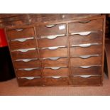 Vintage wooden bank of eighteen draws {61 cm H x 84 cm W x 40 cm D}.