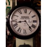 Early 20th C. metal wall clock advertising Guinness Park Royal {51 cm D}.